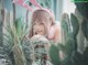 A young woman wearing a pink bunny ears headband.