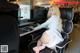 A woman sitting at a desk in front of a computer.